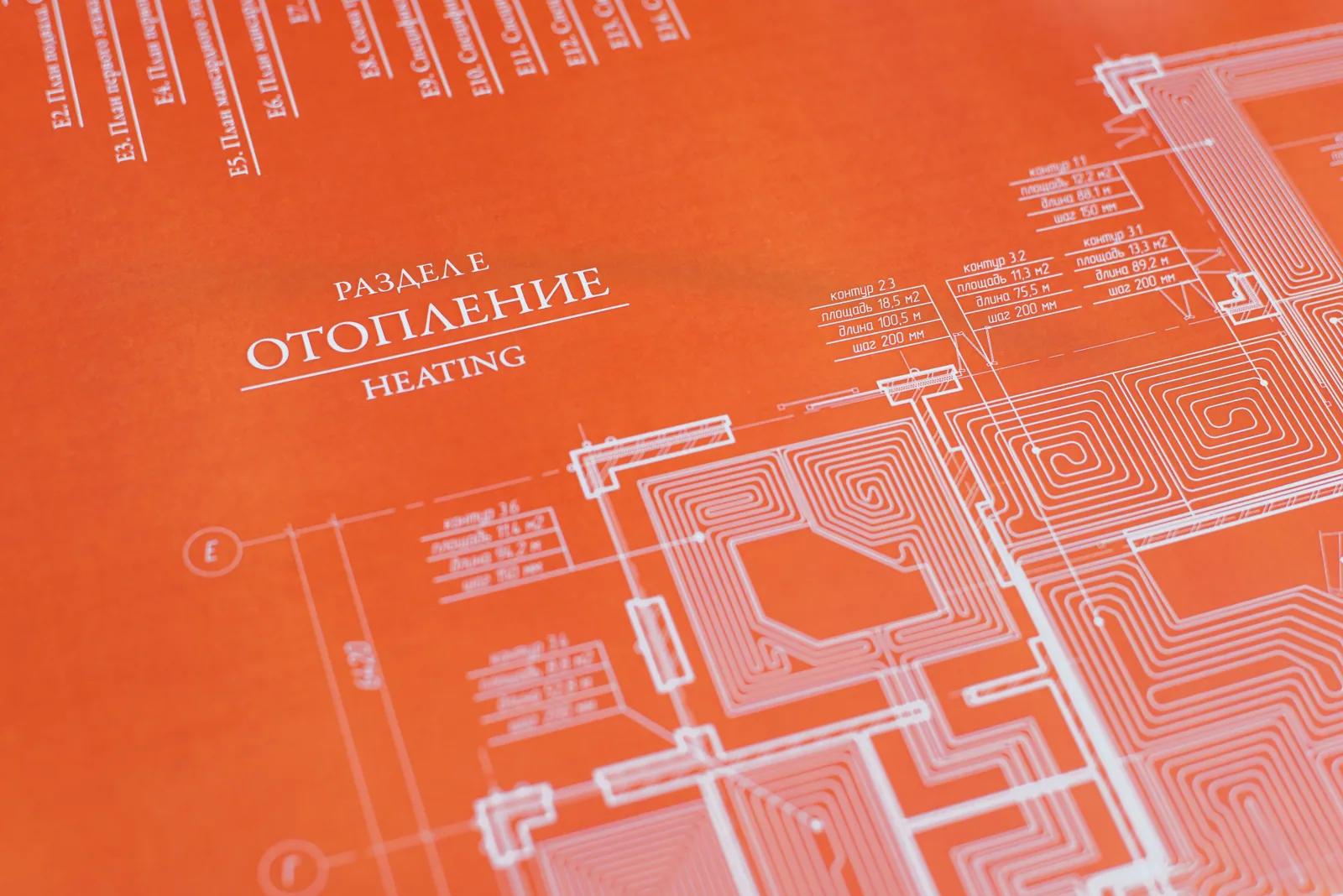 Orange background blueprint showcasing a detailed heating system design plan.