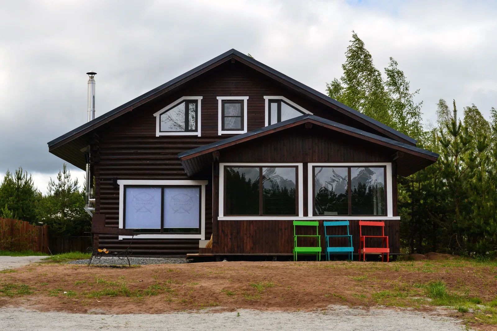 A rustic wooden house amidst nature, ideal for serene countryside retreats.